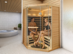 Infrared Versus Traditional Saunas. This image Shows an Infrared Sauna in a home with two people sat in the sauna, enjoying their wellness space.